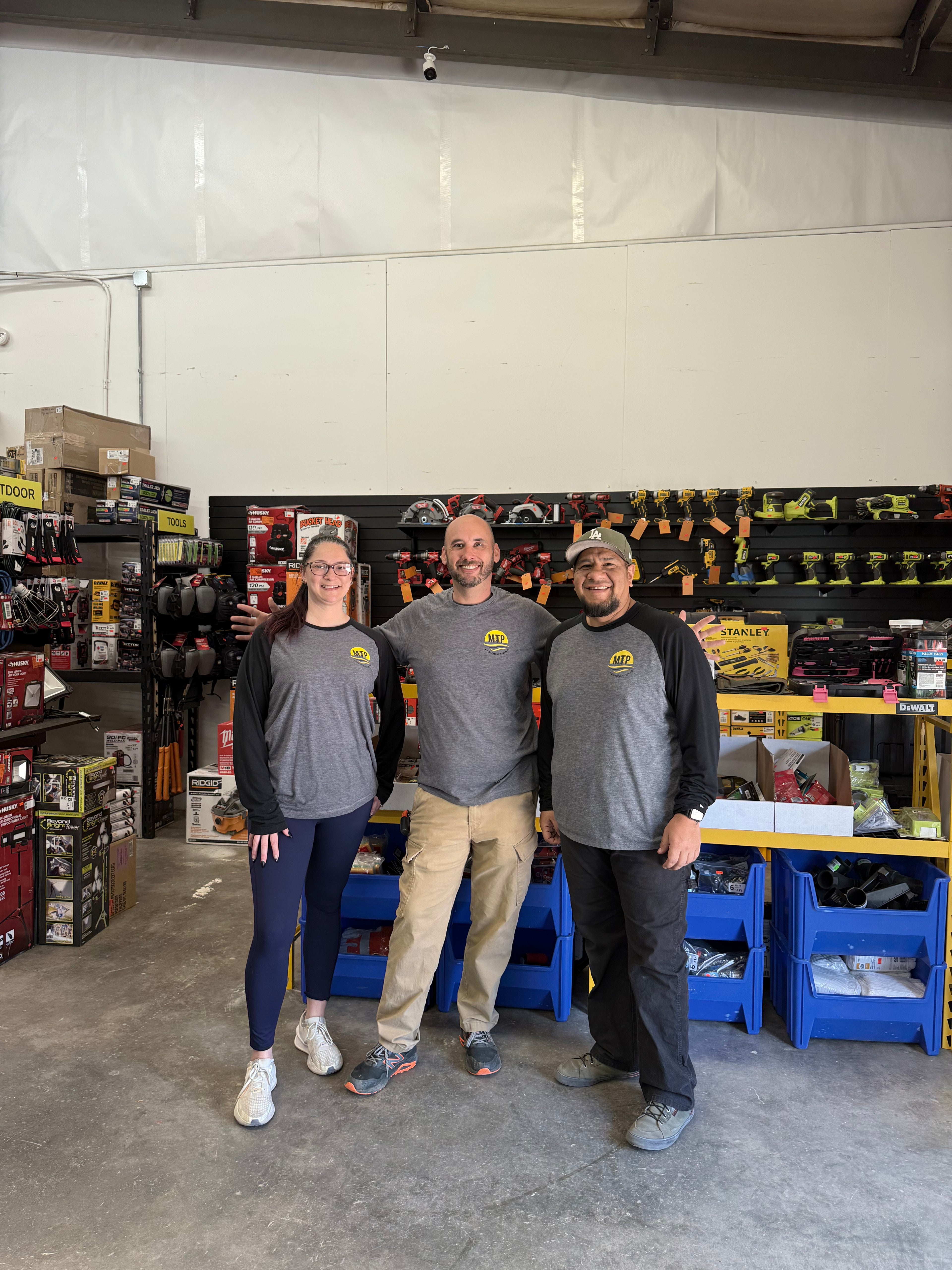 Picture of the MTP Liquidations team featuring CEO Mike Nichols & VP of Marketing Megan Smith
